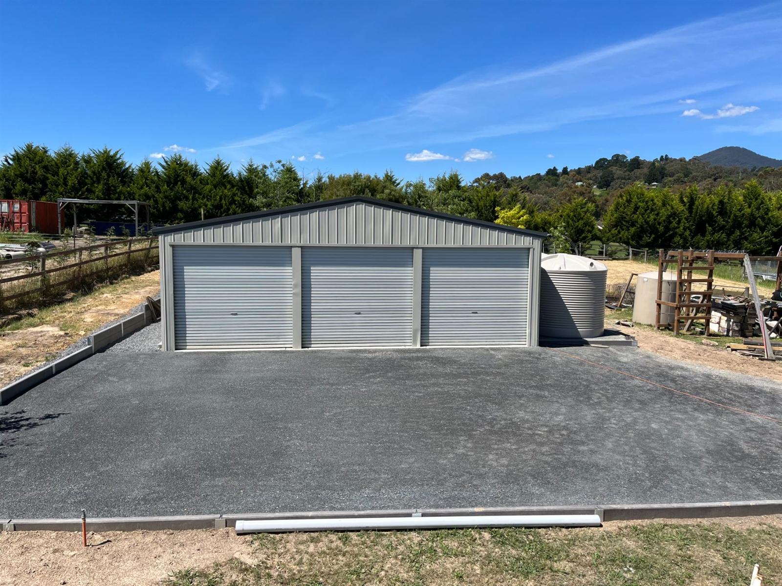 Triple-bay garage with new driveway